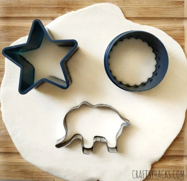 cookie cutters in dough