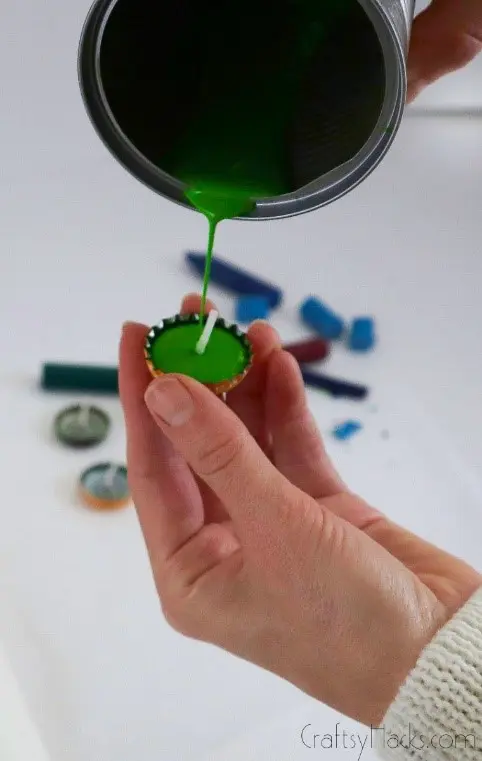 pouring wax into bottle cap
