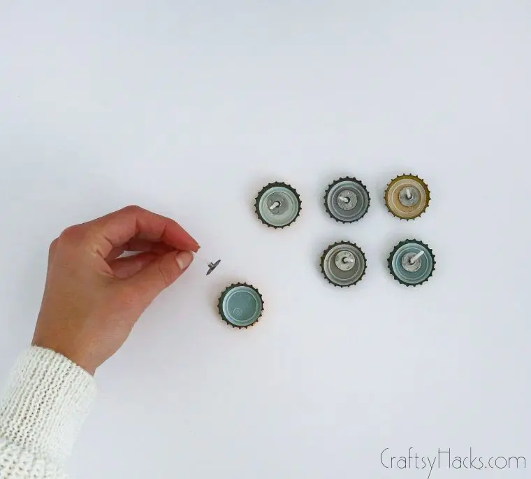 putting wicks in bottle caps