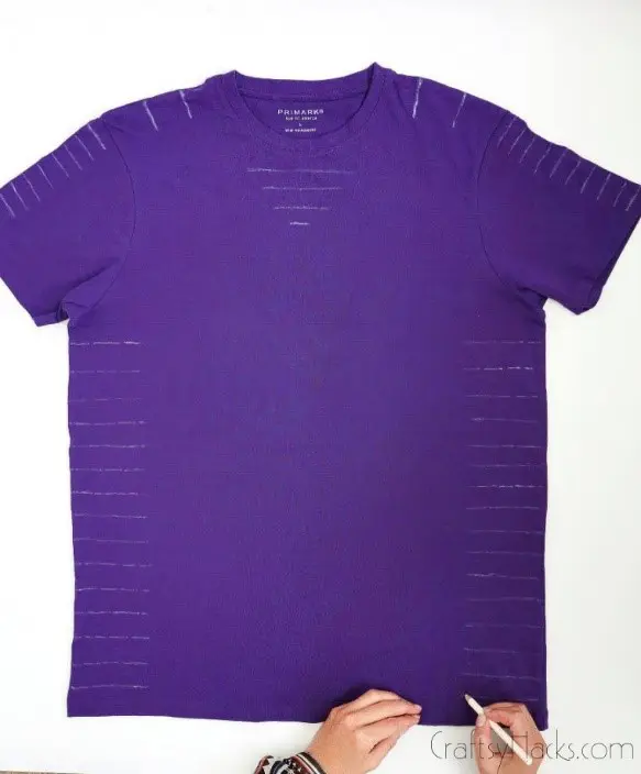 purple shirt with white pencil markings