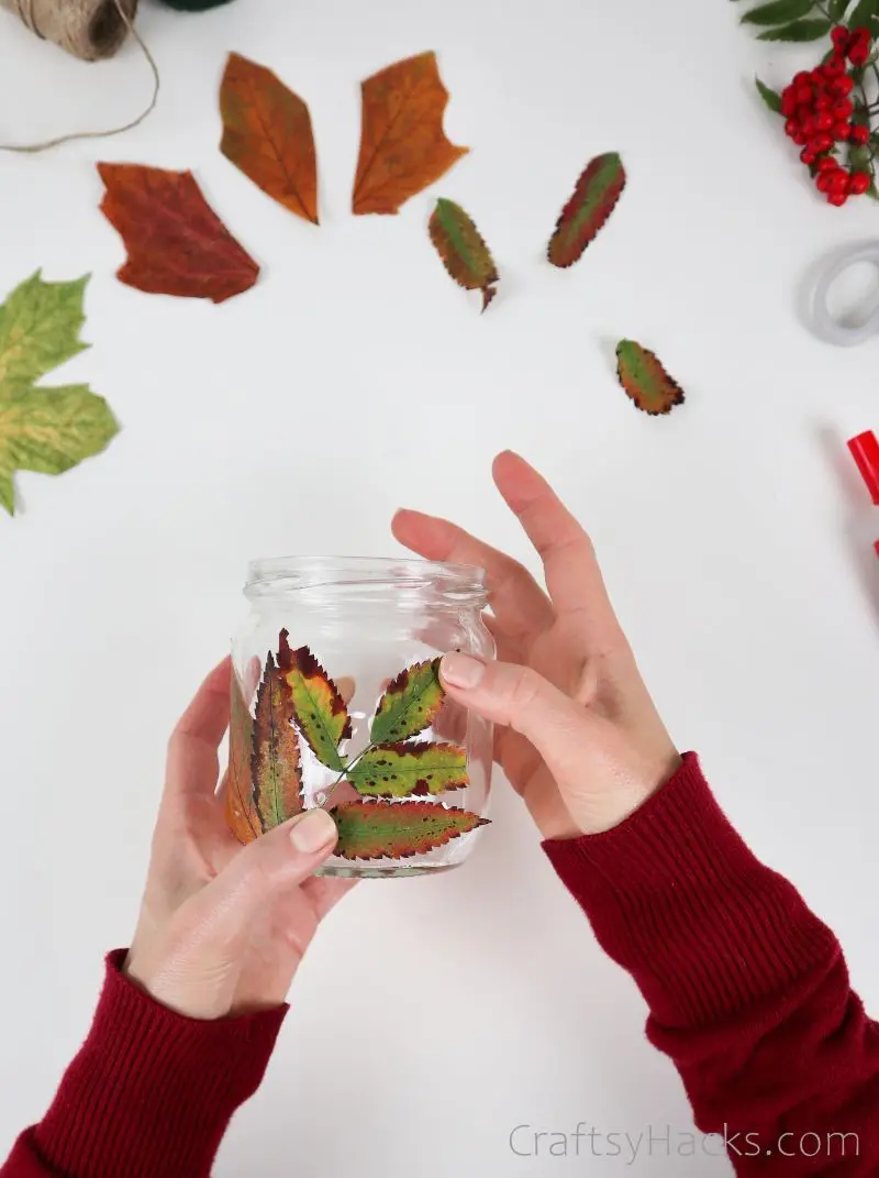 attaching leaves to candle holder