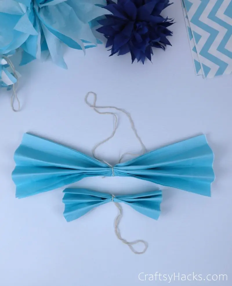light blue tissue with string tied around