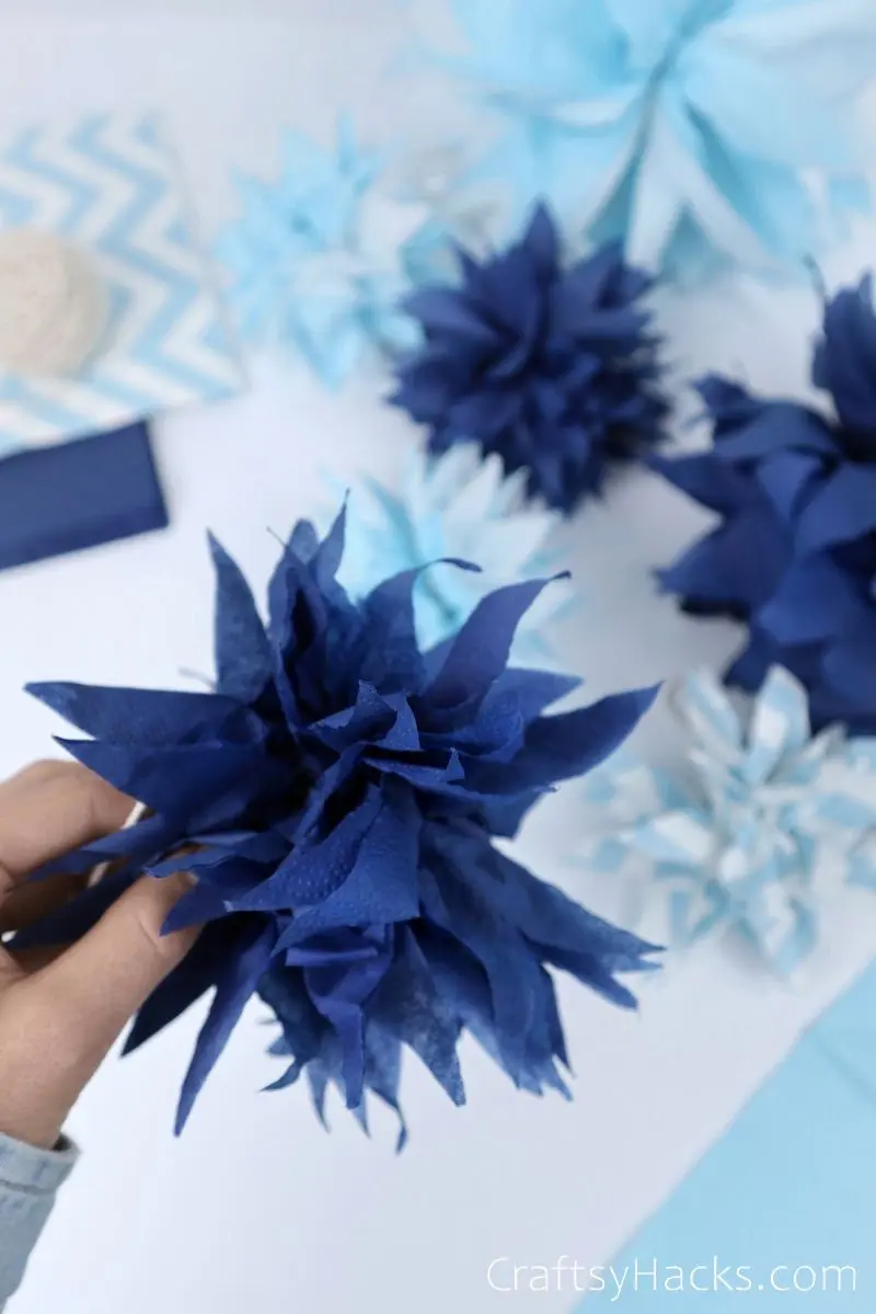 close up of blue pom pom