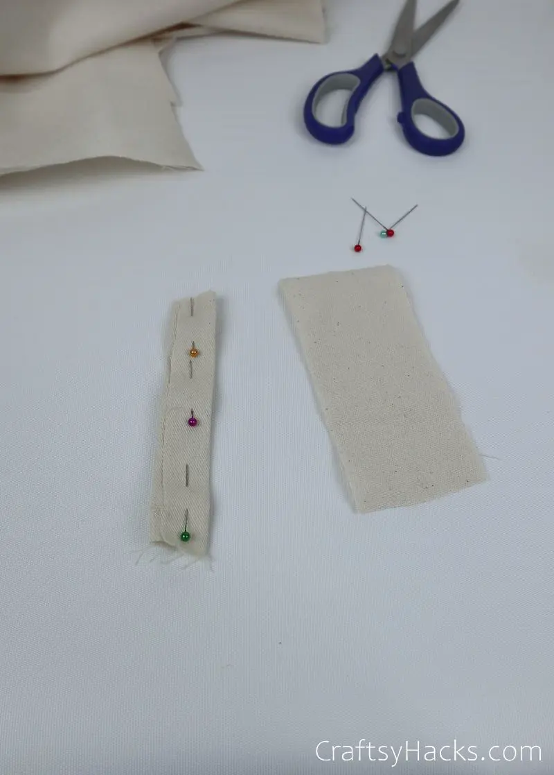 pins in folded fabric