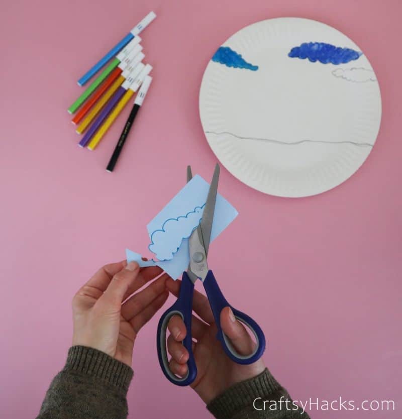 cutting out clouds from paper