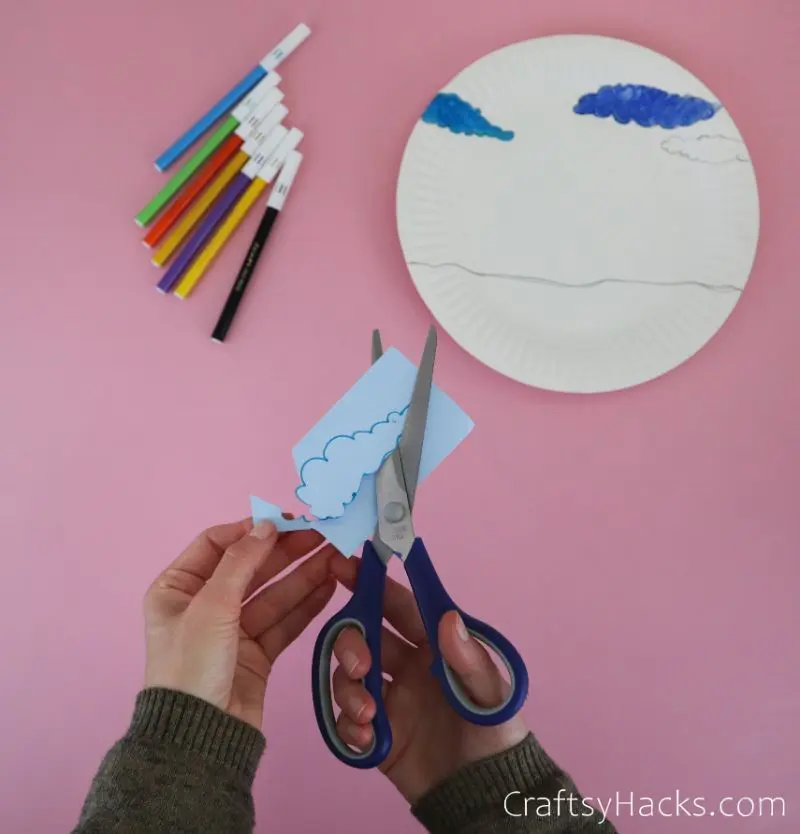 cutting out clouds from paper