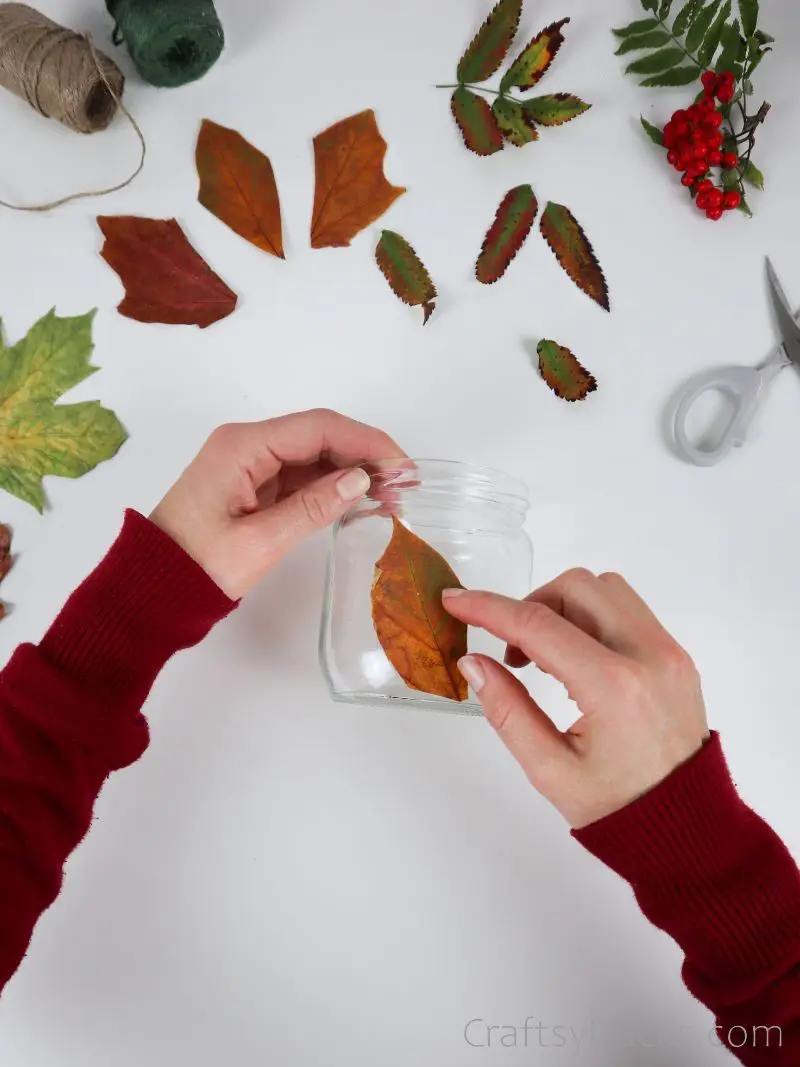 glueing leaf to jar