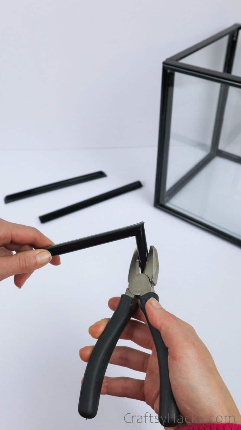 taking apart remaining frame with pliers