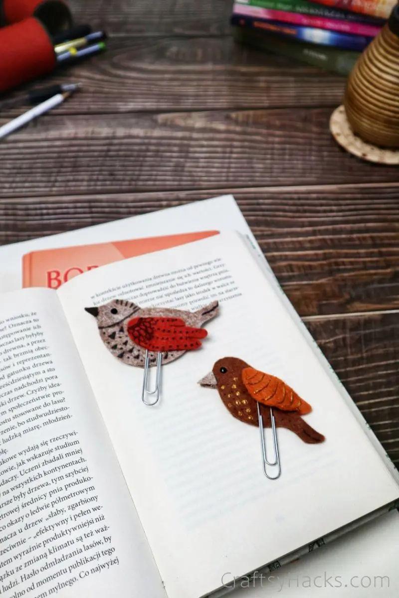 two bird bookmarks in open book