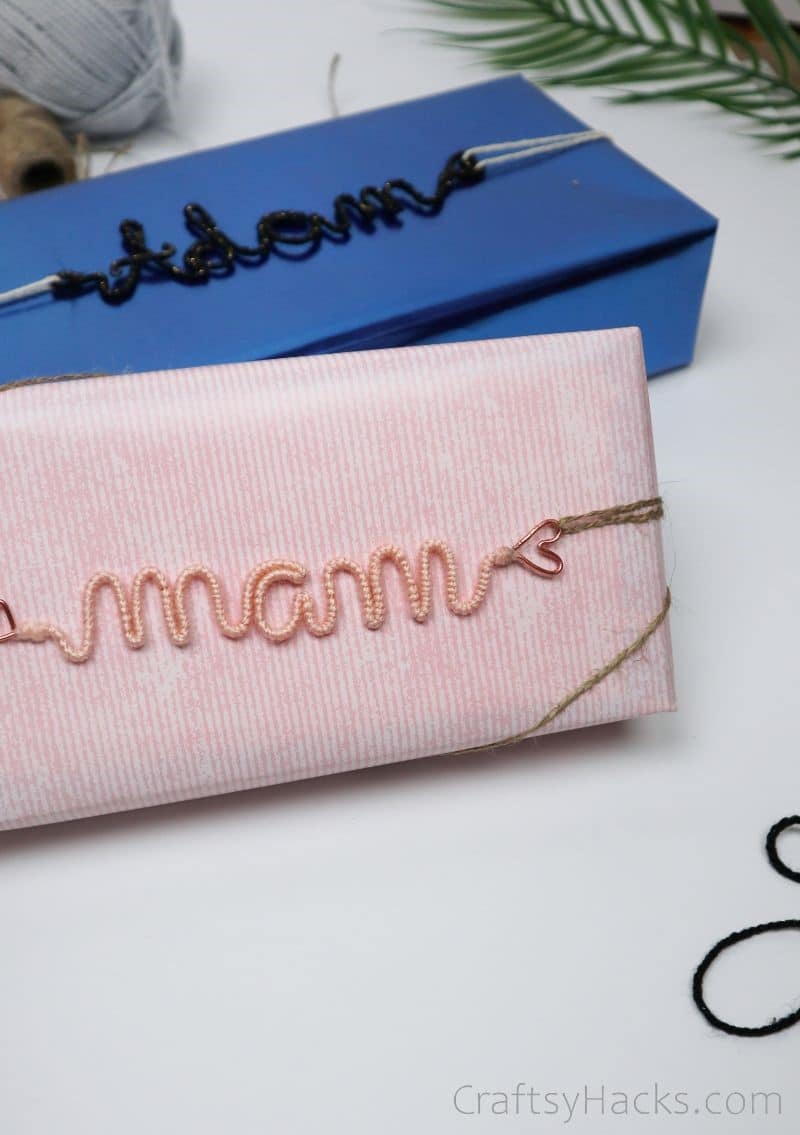 pink and blue wrapped gifts with wire ornaments