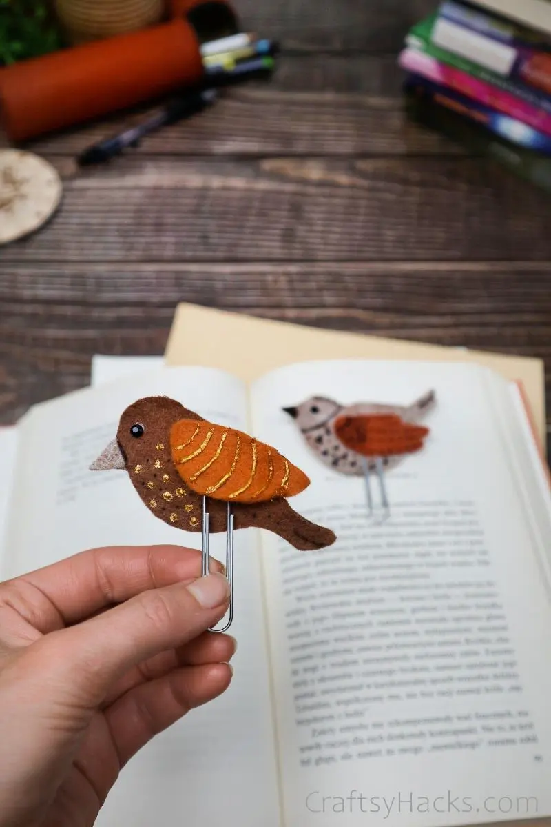 holding bird bookmark