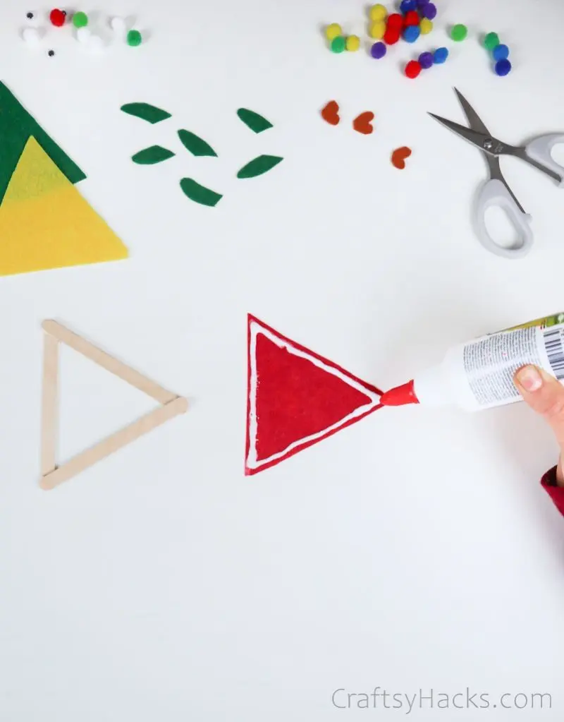 glueing cut felt triangle