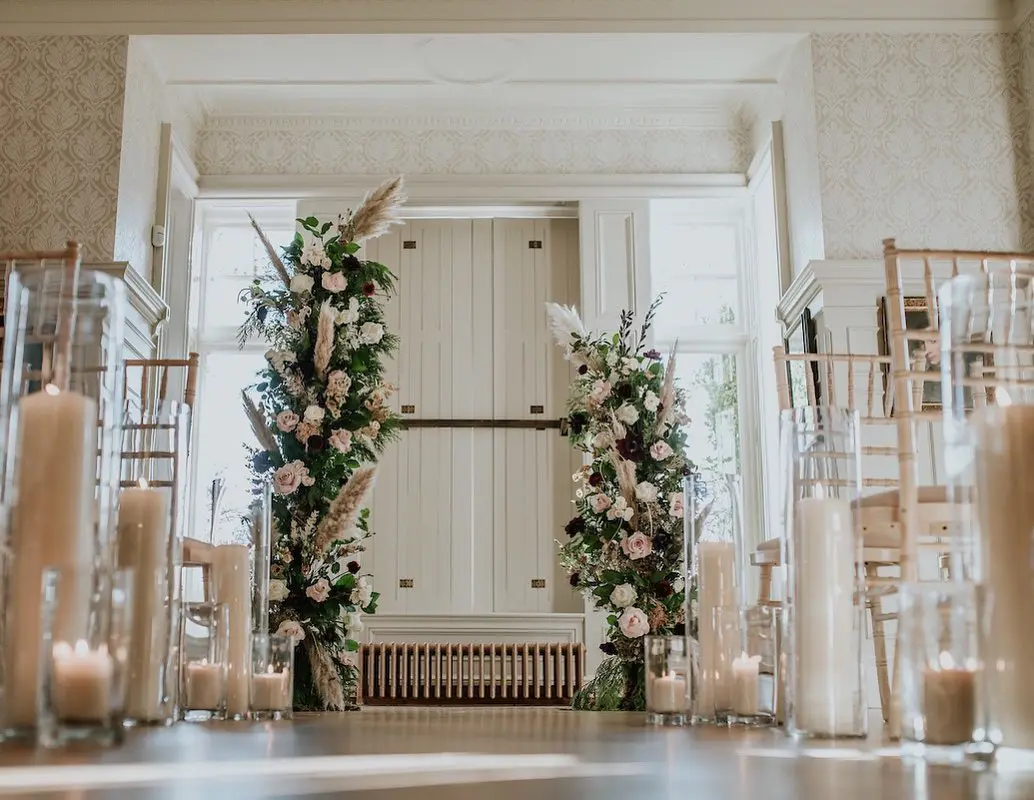 Floral Pillars and Burning Candles