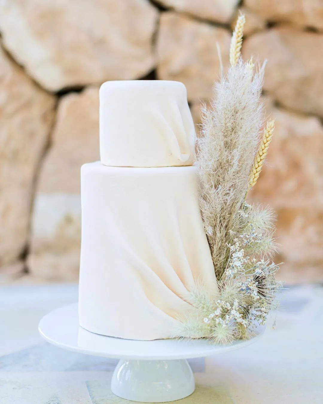 draped cake with grass