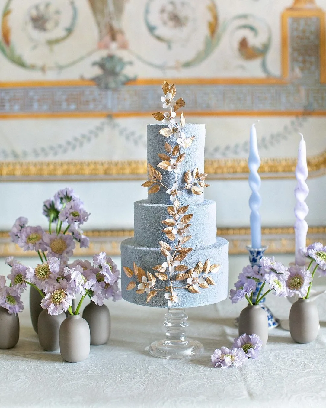 light blue cake with gold leaves