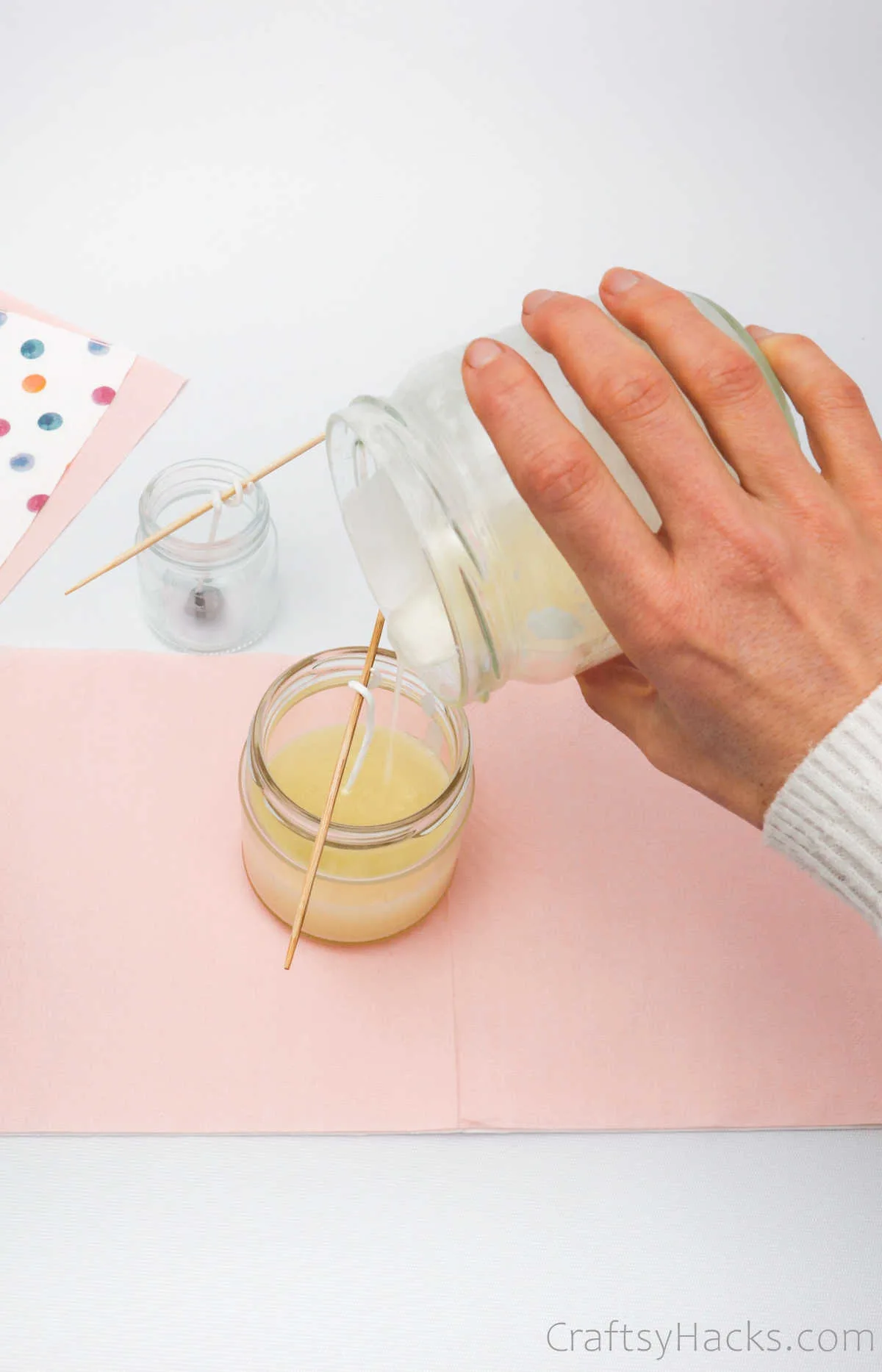 pouring wax into jar