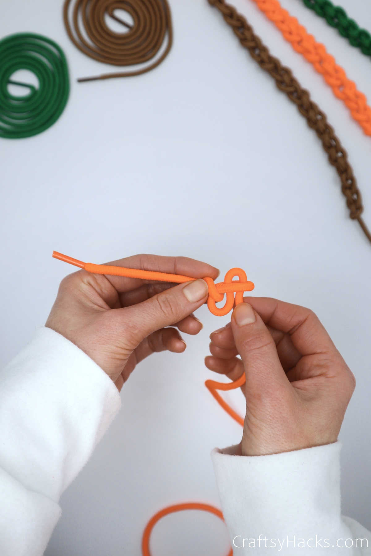 creating second knot with shoelace