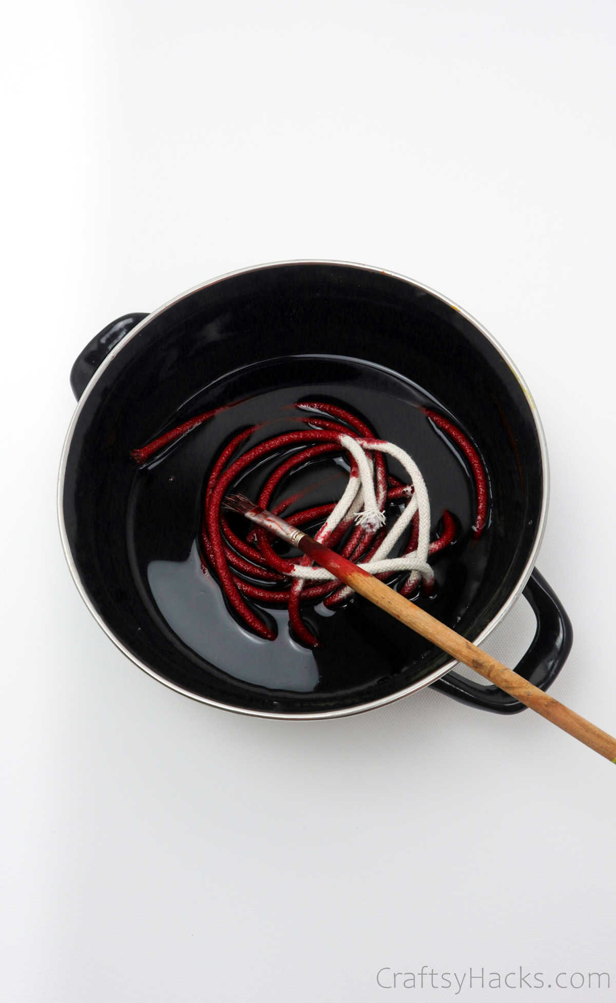 bowl of dye with rope