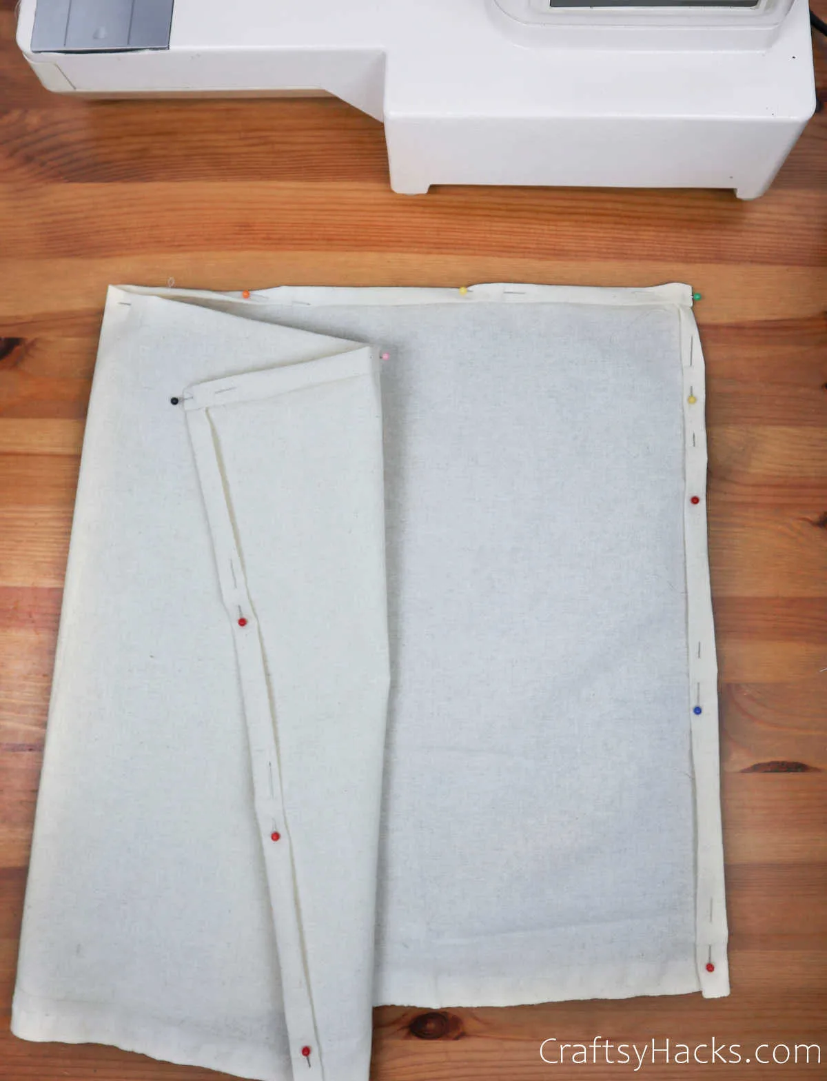 white fabric with pinned edges