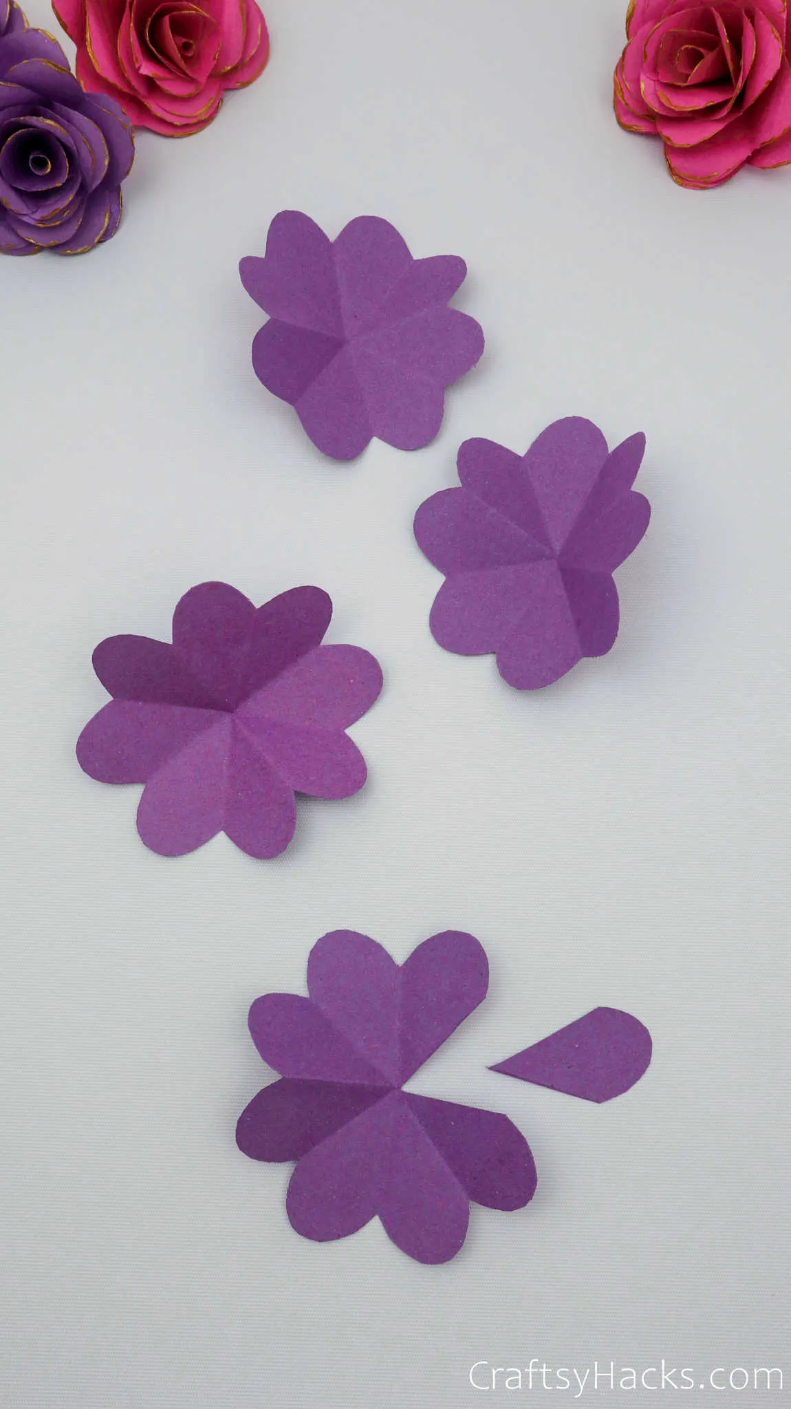 4 purple paper flowers