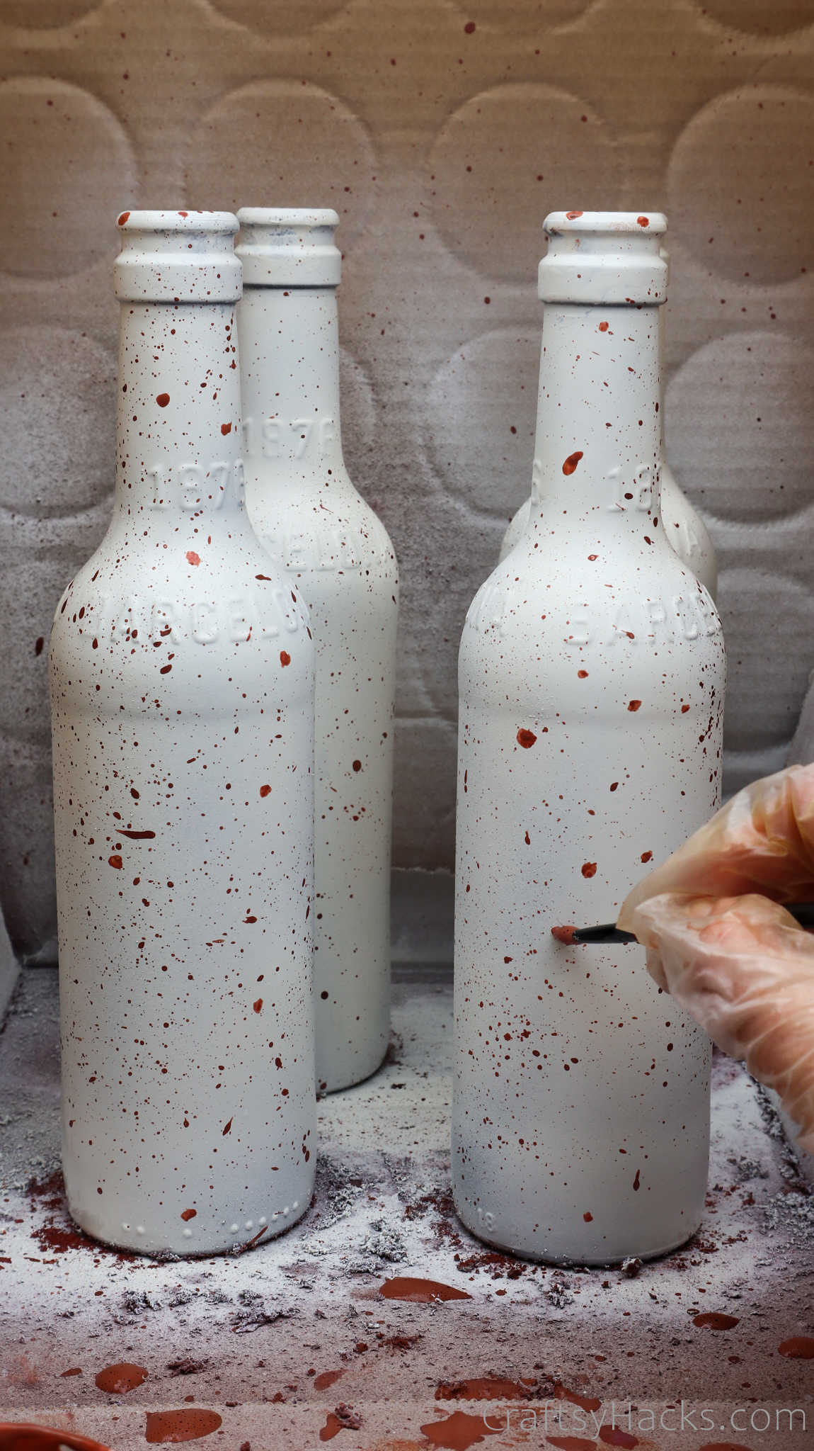 painting dots on bottles