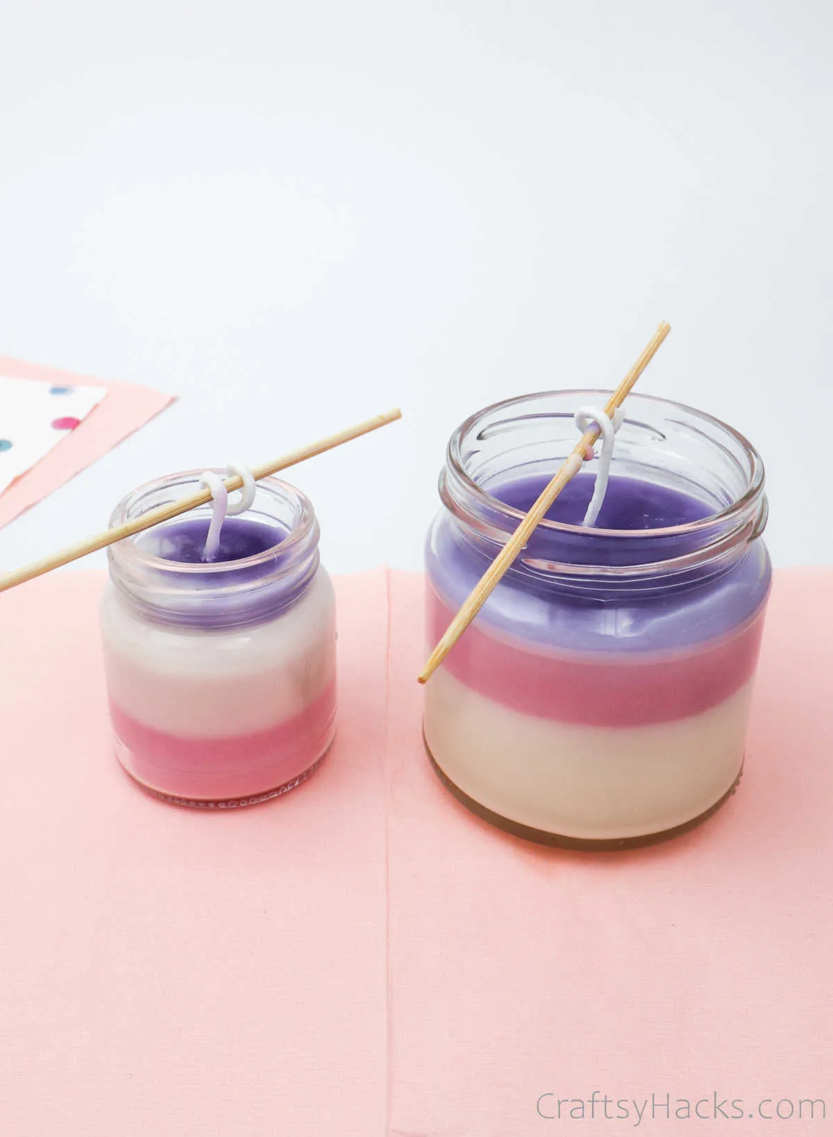 two jars filled with coloured wax