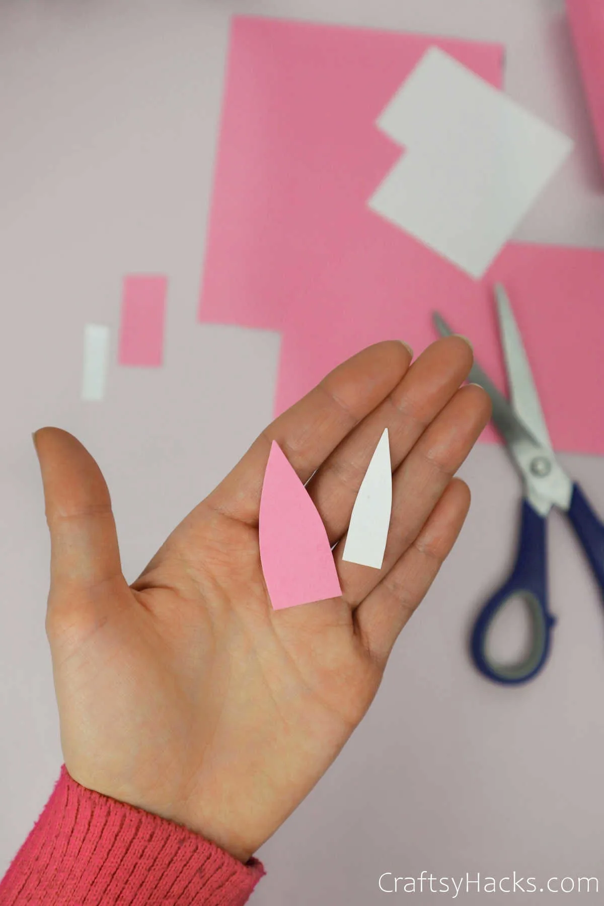 cutting out paper for ears