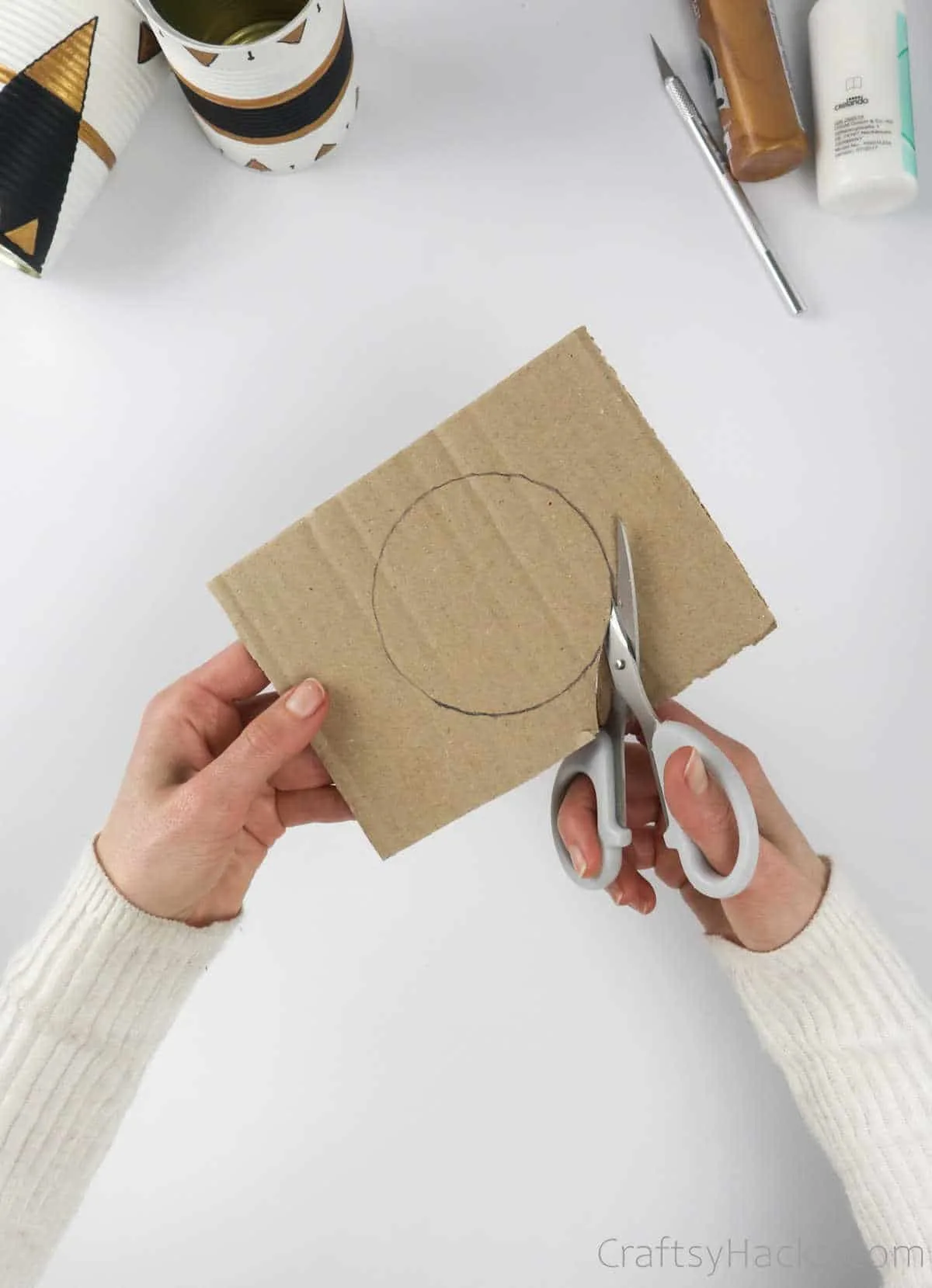 cutting out cardboard circle