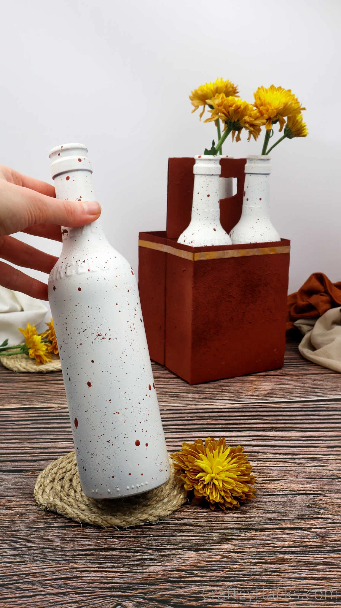 holding painted bottle