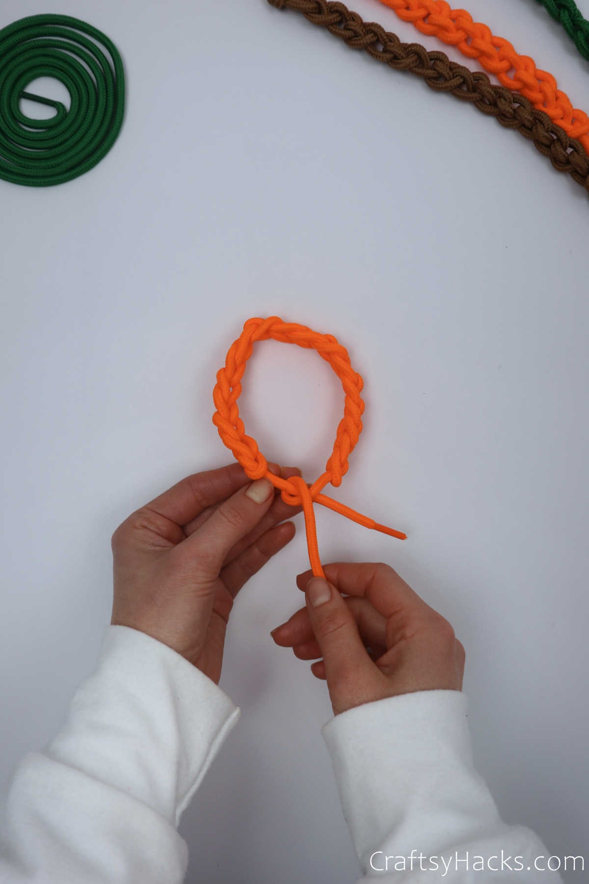 tying knot in bracelet end