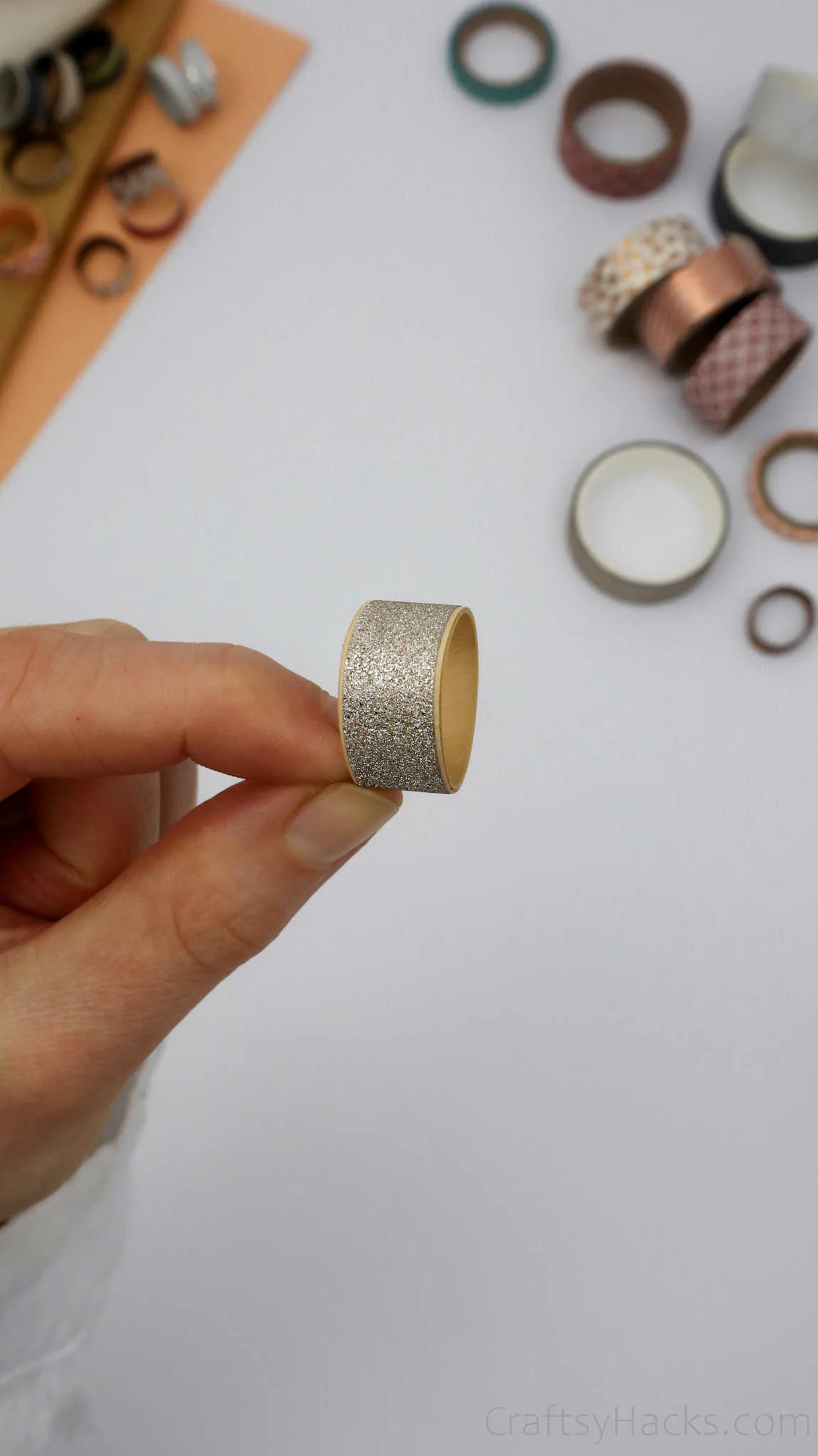 holding silver paper ring