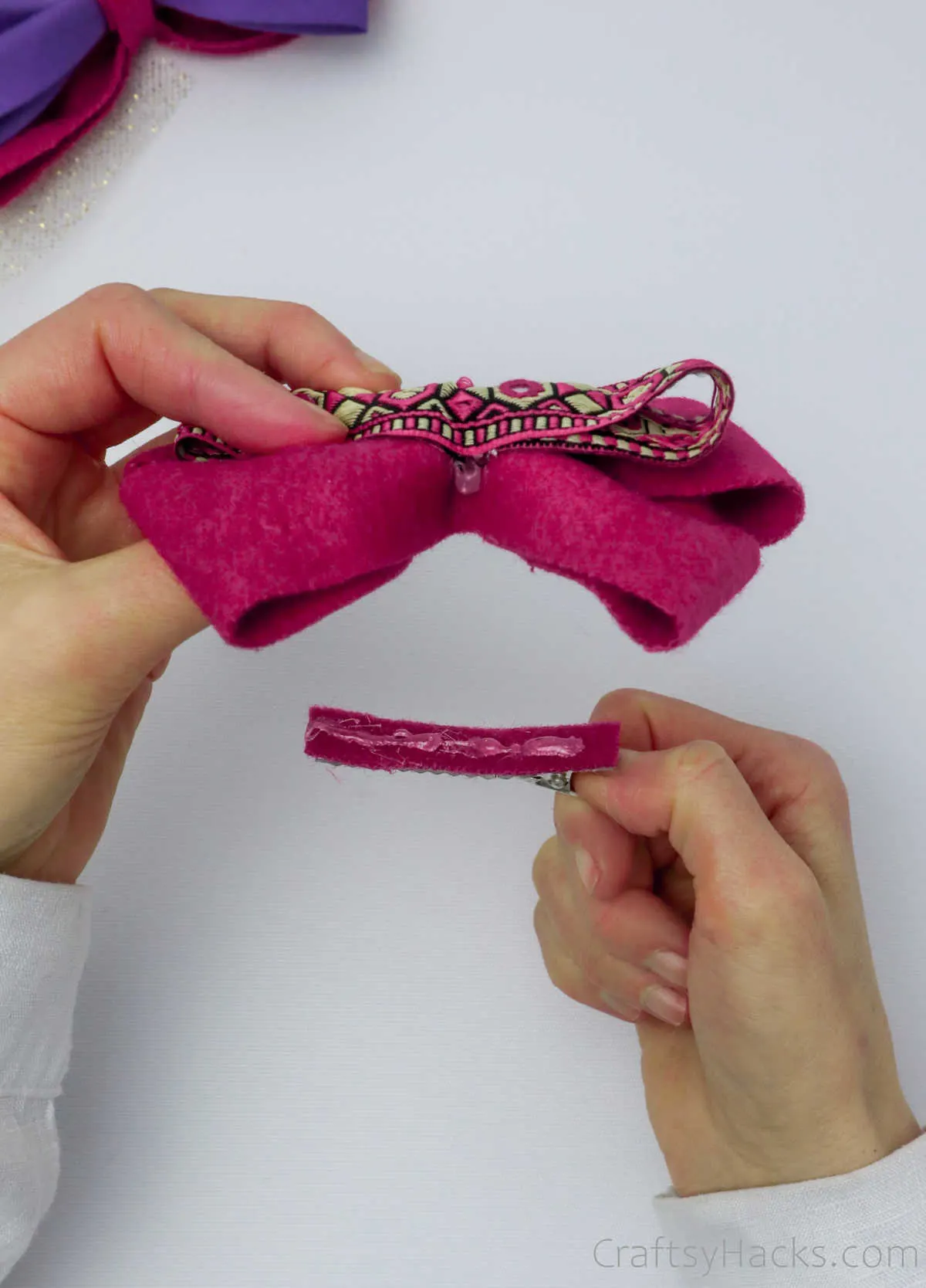 attaching clasp to bow