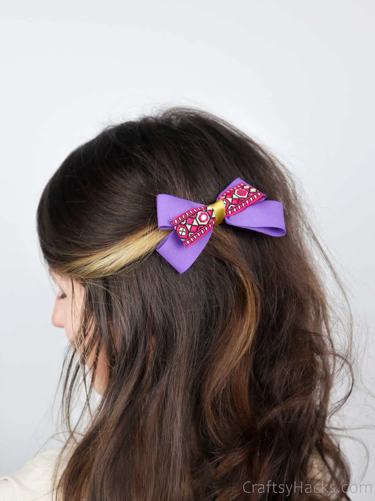 purple hair bow in hair