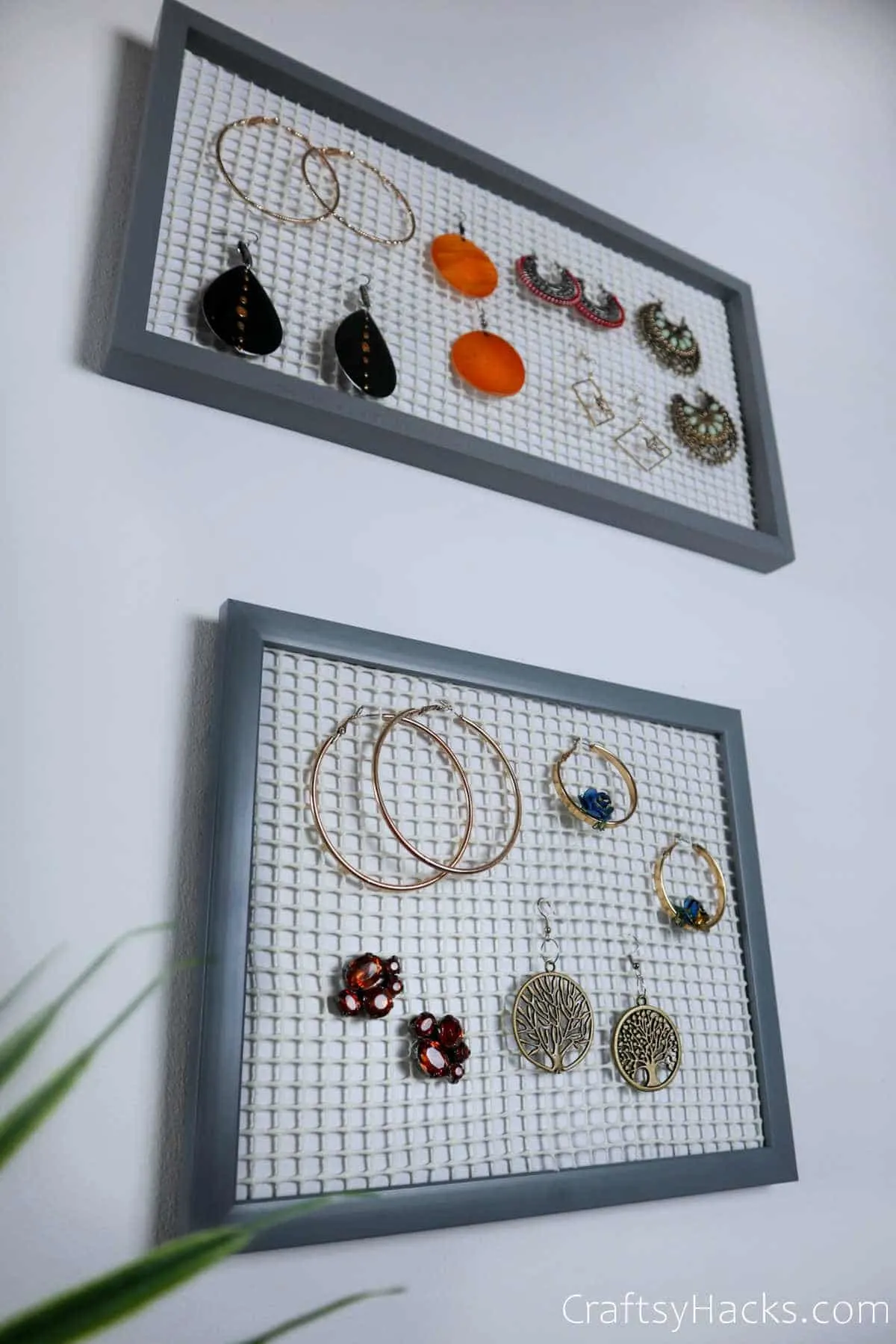 earring organizers hanging on wall