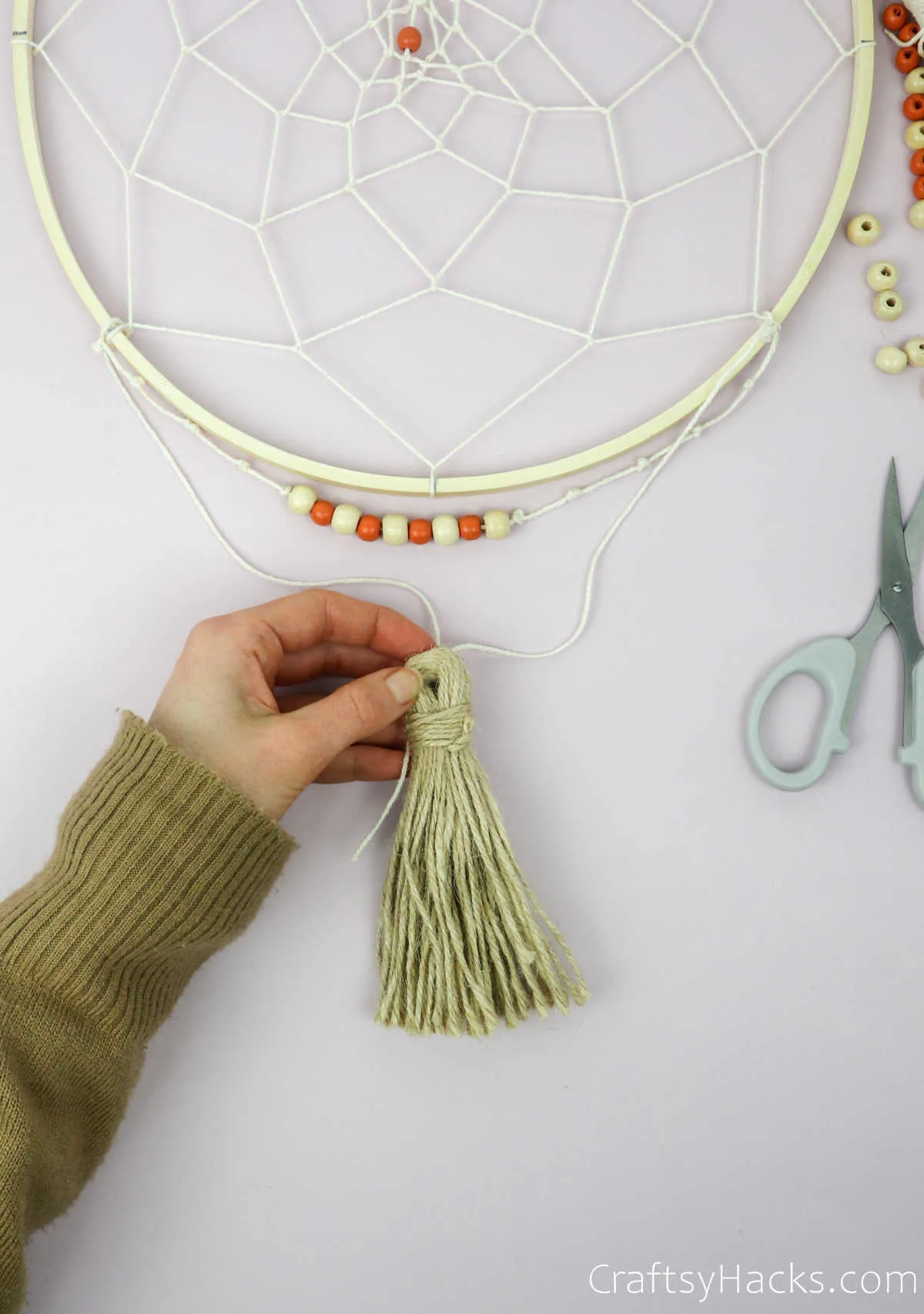 attaching tassle to string