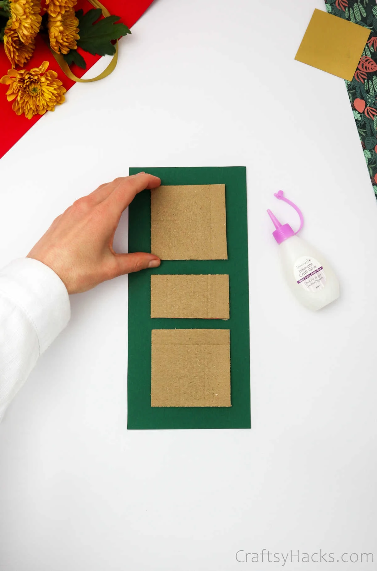glueing cardboard squares to paper