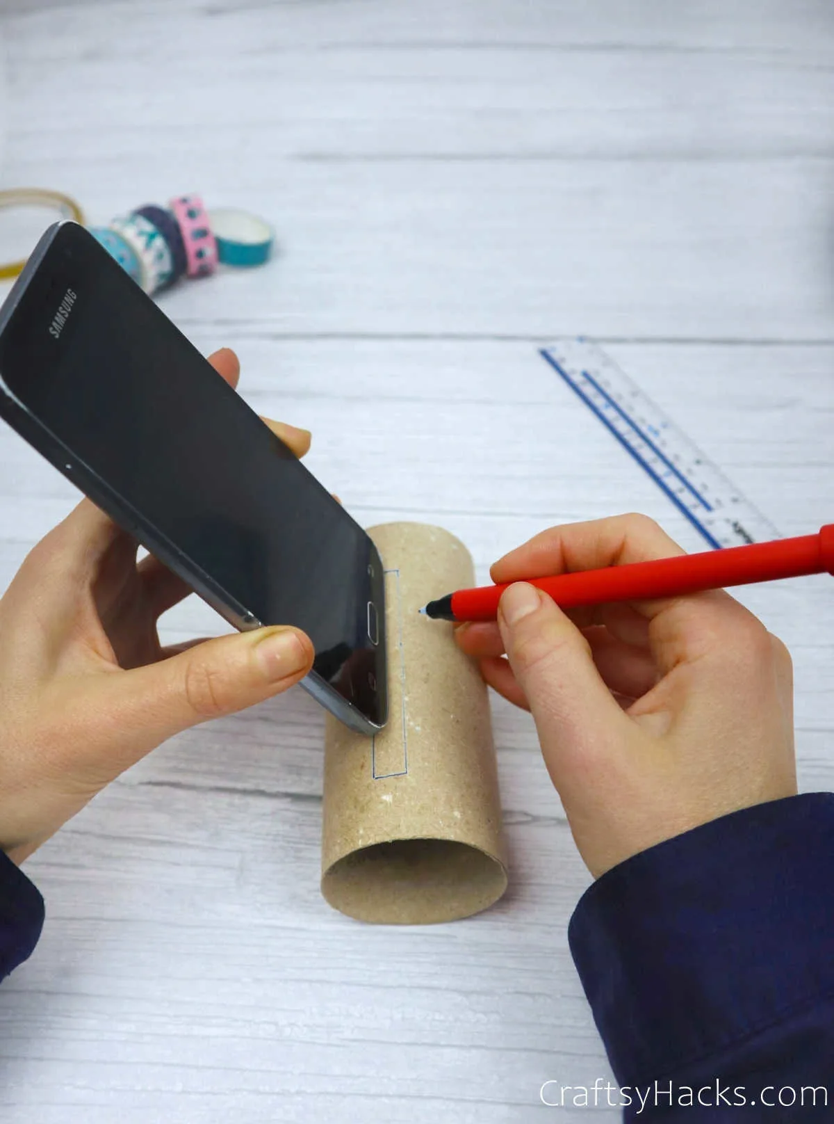 tracing phone onto paper roll