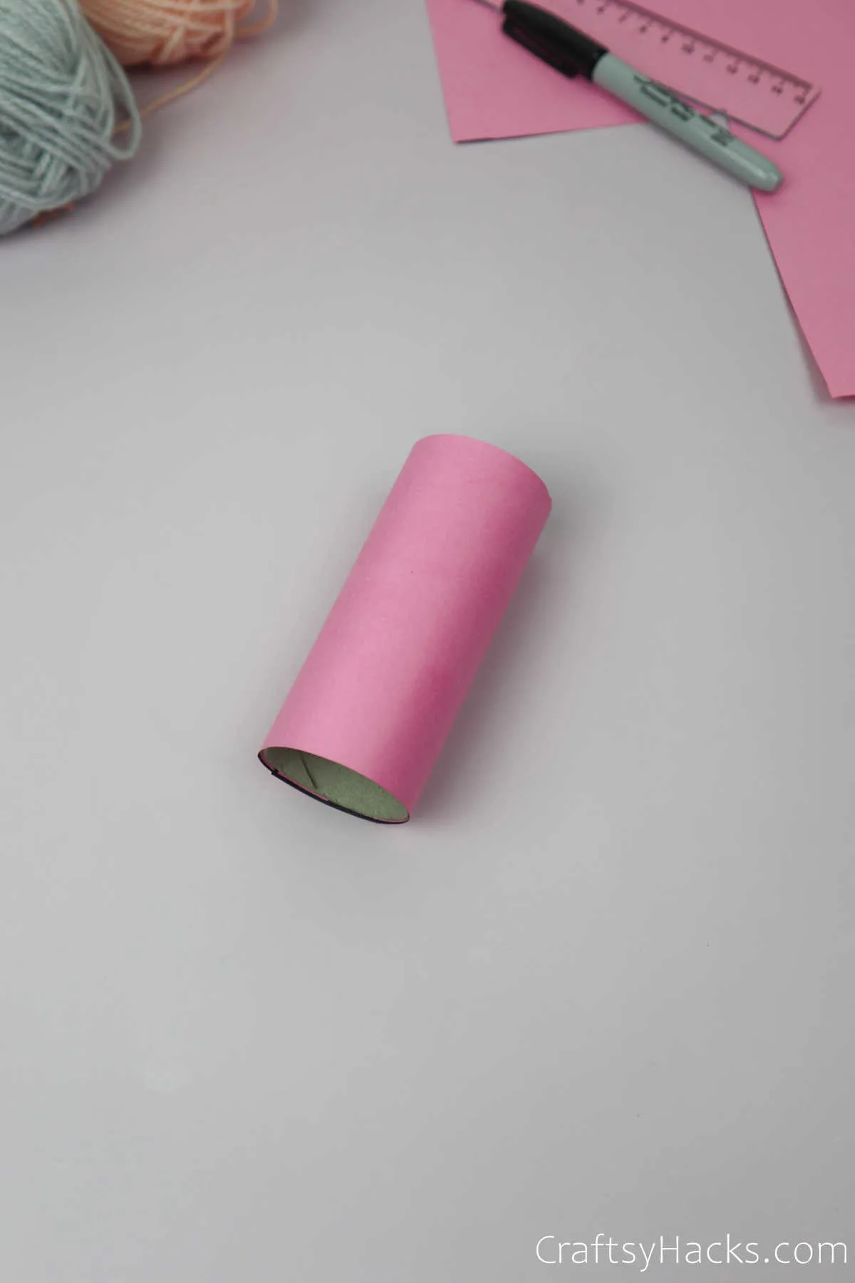 wrapping coloured paper to paper roll