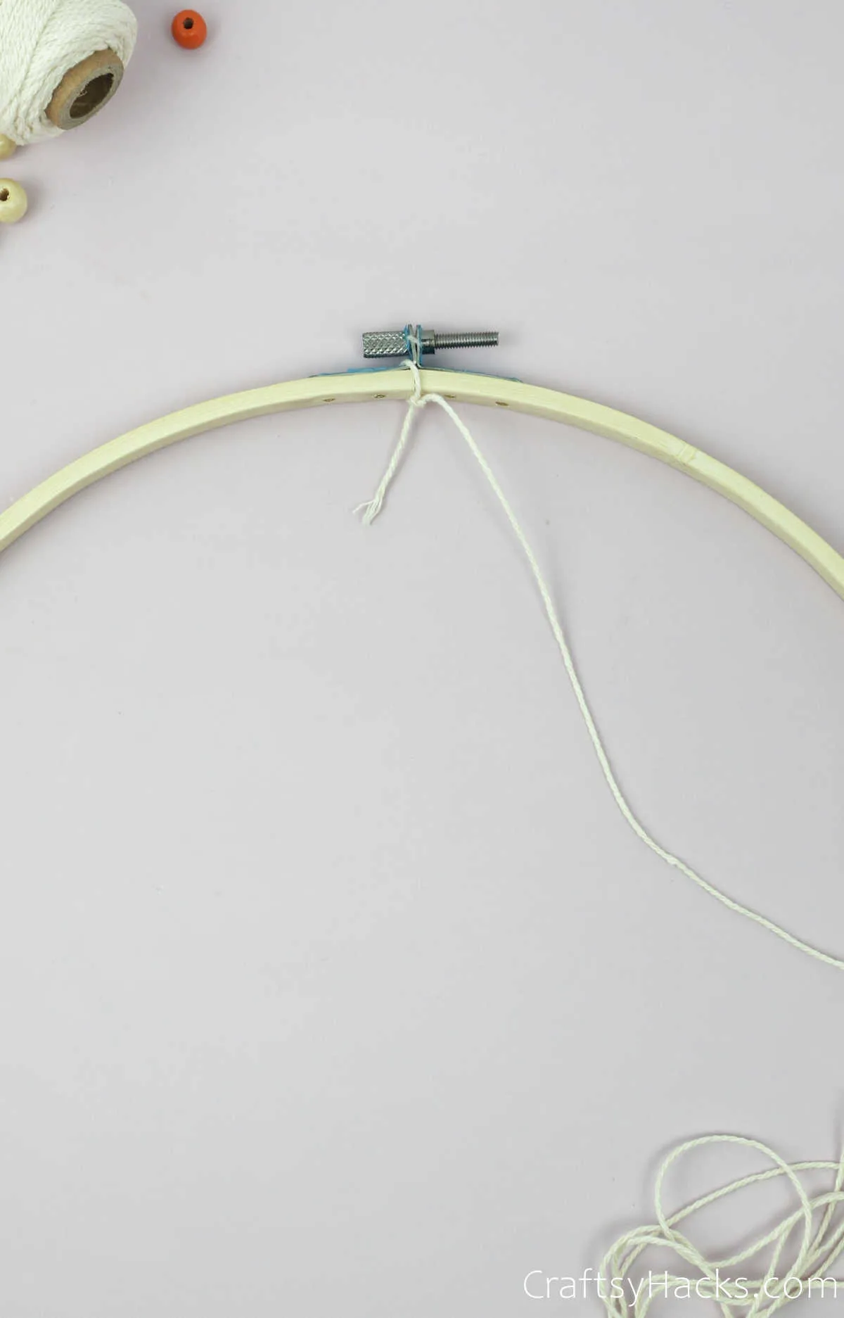 tying string to hoop top
