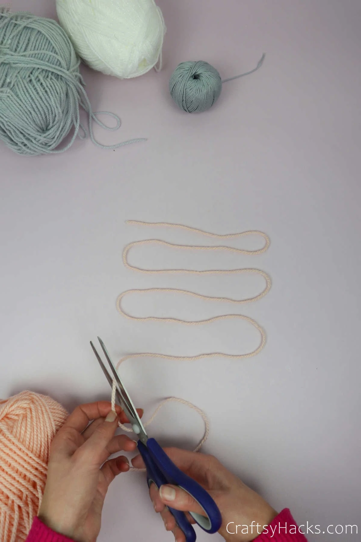 cutting piece of yarn