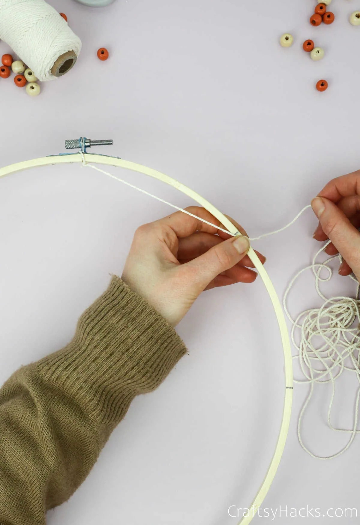 tying string to line on hoop