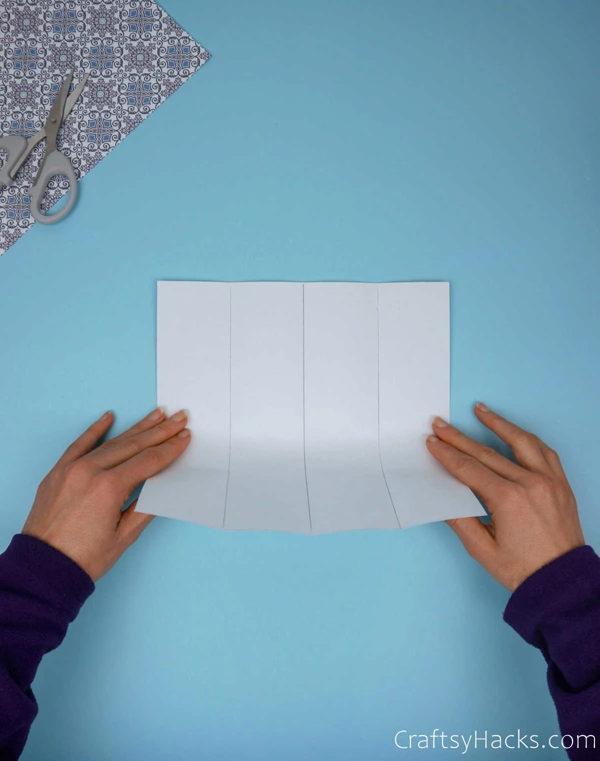 holding folded paper