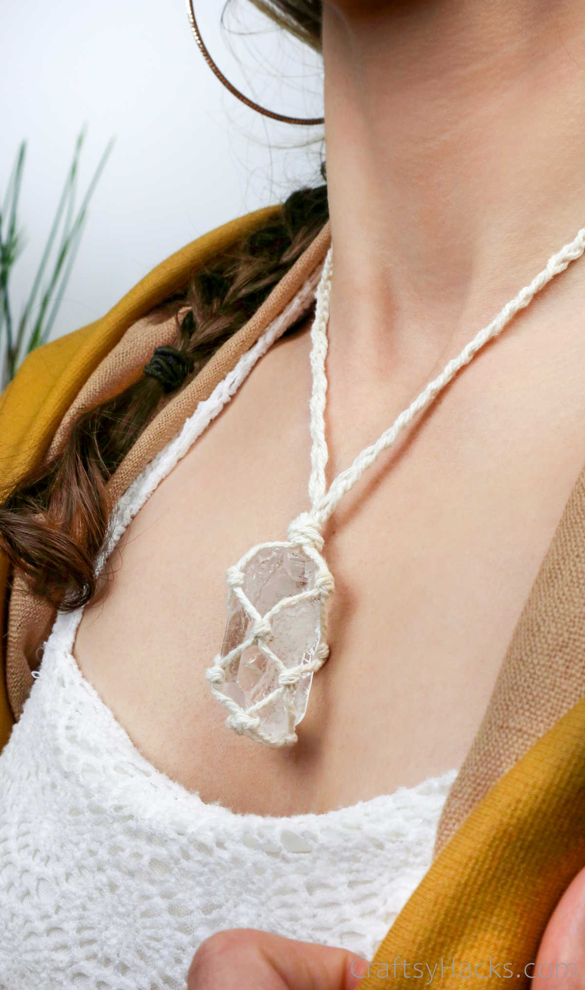 person wearing macrame necklace