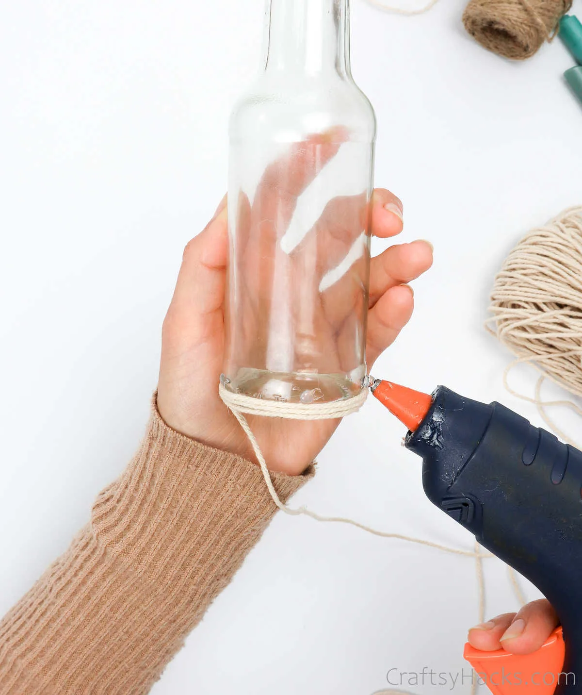 glueing string to bottle