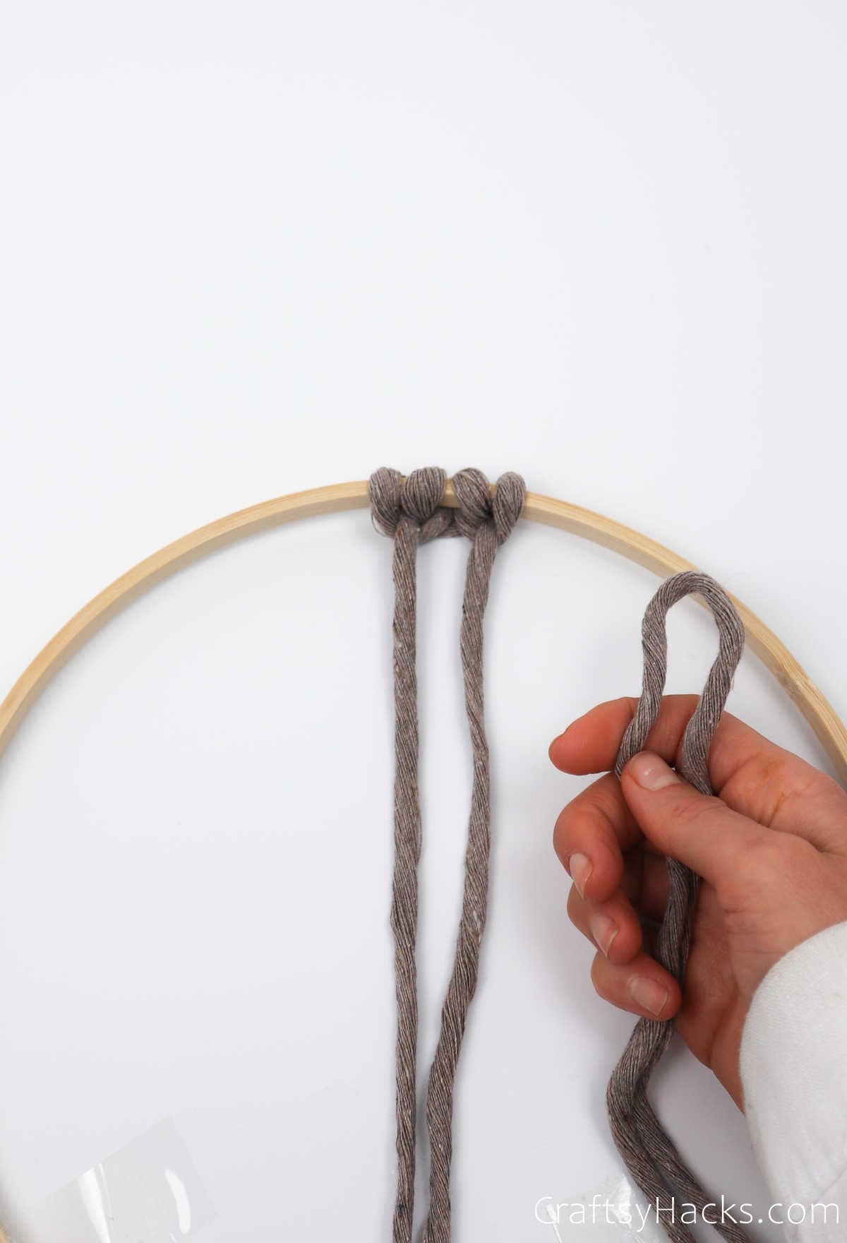 holding loop of string