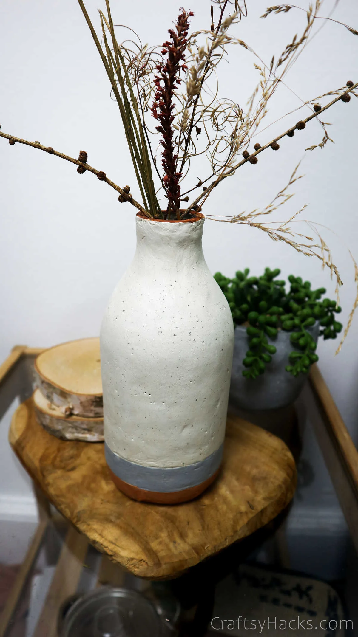 bottle vase on stool