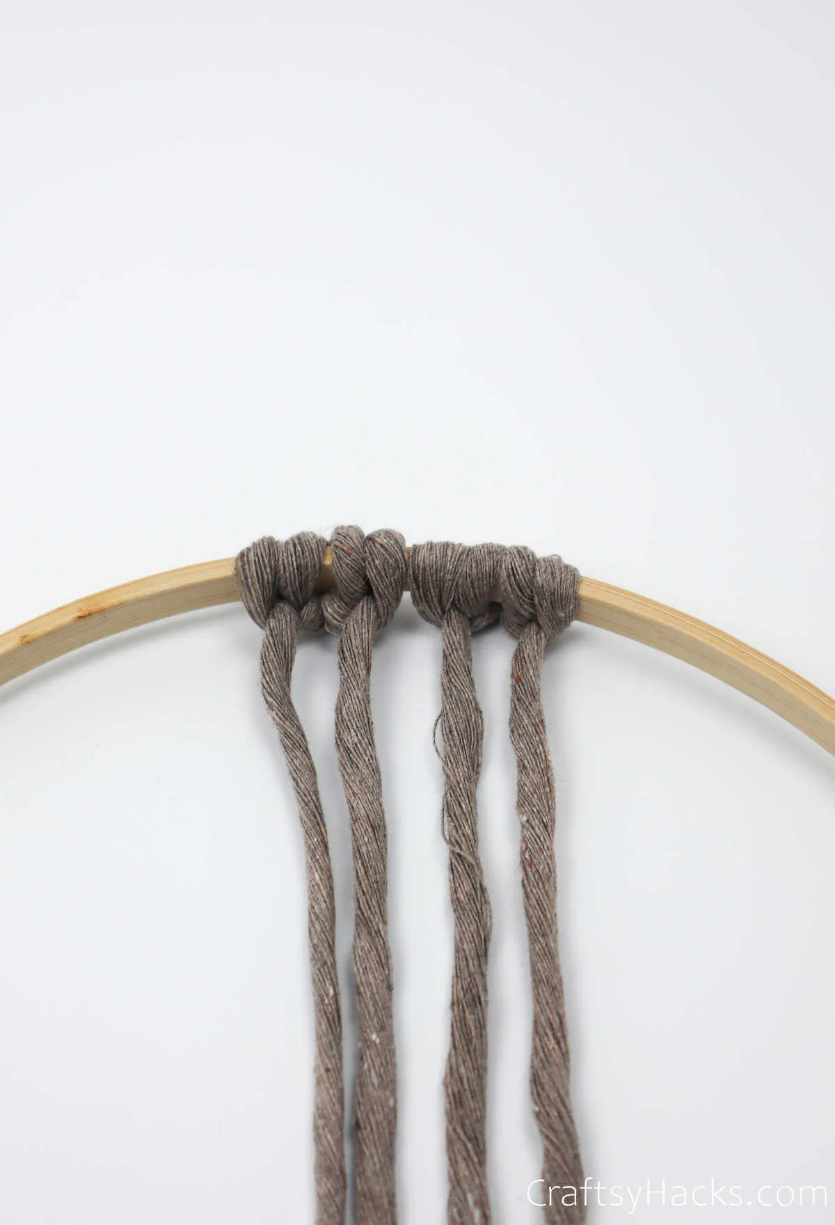 tying two more loops of string