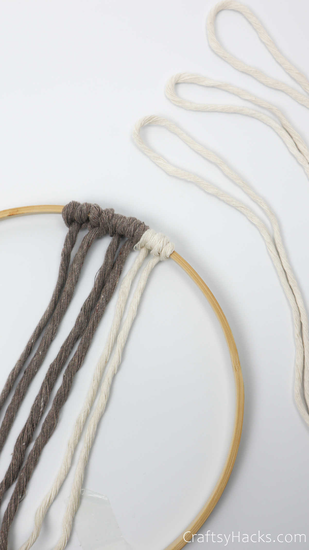 adding knot with white yarn