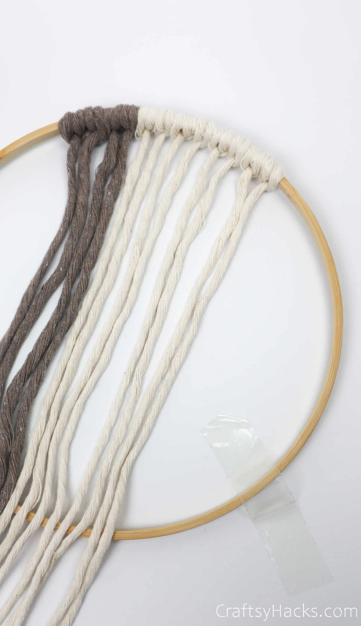 tying more white yarn