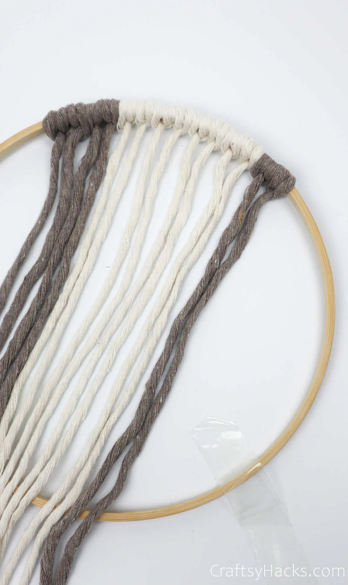 tying more brown yarn